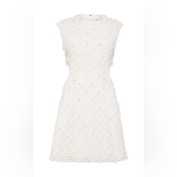 Stunning ivory white open cutting out with delicate flowers cute detailing. - Picture 14 of 16